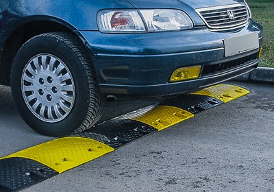 Speed bumps installed in a private UK car park for traffic calming and vehicle safety