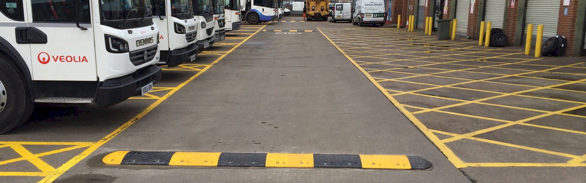 Private parking area with speed bumps designed to reduce vehicle speed and improve safety